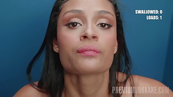 Young Latina Breiny Zoe sucks dicks sticking from the wall