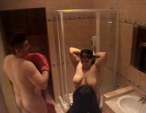 Two chubby brunettes enjoy taking a shower with a guy