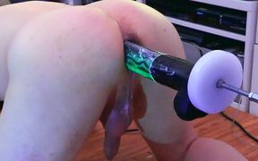 Machine fucked in the ass by glowing mamba dildo on the machine