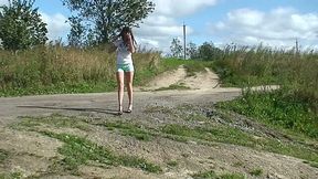 Gorgeous skinny brunette teen in sexy shorts pisses by the road