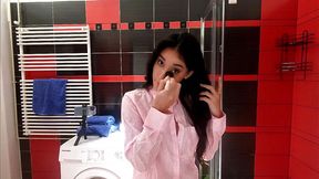 Hot petite brunette babe in the bathroom prepares for a night out in panties and a shirt