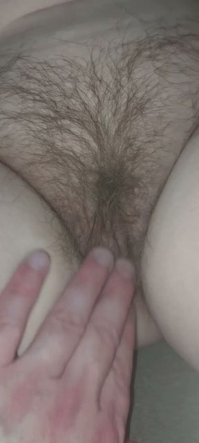 Rubbing 50 yr old Wife's hairy pussy