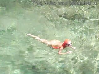 Yellow swimming trunks and blue water