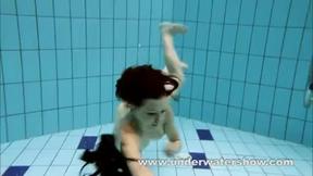 ”Brunette Kristy is stripping underwater”