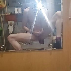 A young sexy guy jerks off a dick with giant prolapse (guts) from his hot ass in the toilet, looking at himself