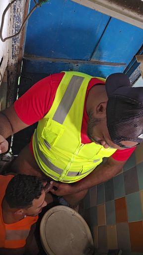 Construction Site Bathroom and Workers