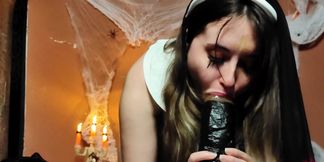 Nun Sucking a Huge Black Dildo with a Lot of Saliva