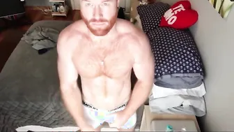 Ginger Bear Seth Forena Strokes His Thick Cock on the Sofa