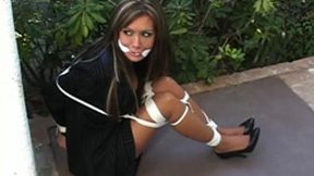 Pretty businesswoman Crissy Moran was left bound and gagged near the entrance to her home!