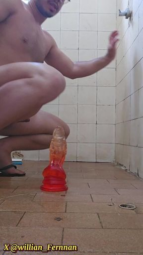 Putting a Huge Dildo in the Ass.