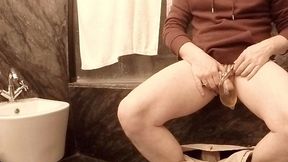 this amateur stud was dared to pee in a condom in the bathroom... fail! (piss spills everywhere when he takes it off :p)