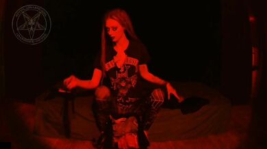 The demonic bible summoning her goth kink into pure blasphemy