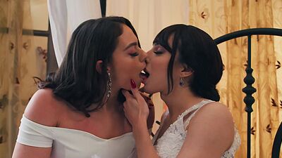 Sophia Burns carries her newly wedded wife Ariel Demure in their bedroom