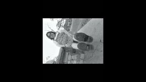 Nurse vicki models in her black and whot hogwarts outfit and spiked boots