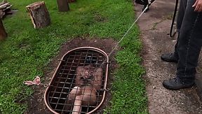 Two shabby looking hussies get locked in metal hatch and poured with cold water