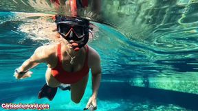 Carissa in the spring wearing a red one-piece vintage bathing suit