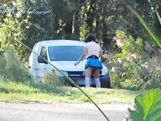 Outdoor car windows cleaning by the road