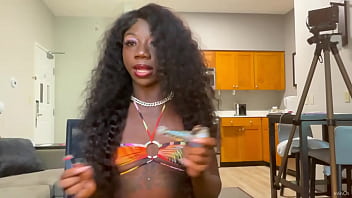 Ebony babe LOLA BLACK licks lollipop and wows with tattoos