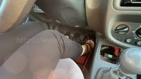 Joyce driving with black sandal and barefeet