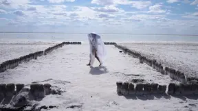 Sensual white wife dances seductively by the lake