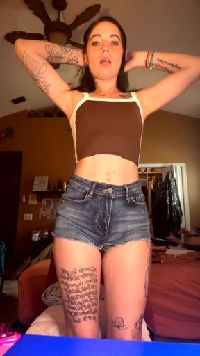 Female Onlyfans Model in Tank Top and Jeans