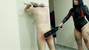 BDSM spanking. Dominatrix Nika spanked her slave's bare ass.
