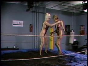 Hot kinky girl wrestling in the mud