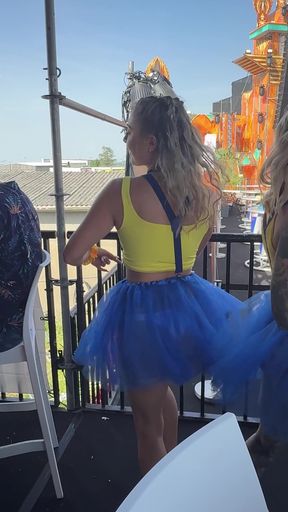 Blonde girl in blue tutu at outdoor event