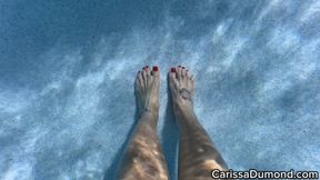 Carissa underwater in the hibiscus bikini with pedicured toes and wrinkled soles