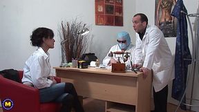 Mature woman is fucked and fisted by two kinky doctors