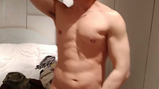 stripping and flexing through my hoodie, tanktop, briefs flexing my muscles