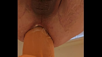 Culorico157 sitting on a 3.8 inch diameter Monster dildo