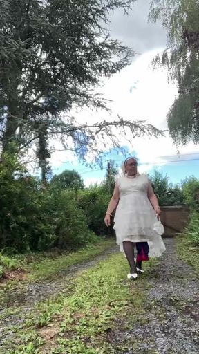 In an outfit with a long white dress for an evening.