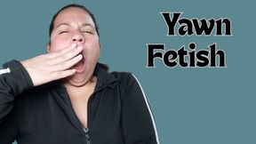 Drinking coffee and yawning