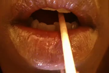 Check out juicy glossed soft lips sucking a lollipop