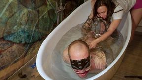 Bondage Bath - Heavy and Elise Graves - Locked in a strict handcuff hogtie in giant bathtub, Heavy is teased and tormented by Elise!