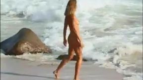 marta gets naked on a beach to get a tan before a man fucks her booty