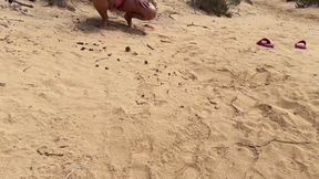 Quick pee in the sand on the nude beach