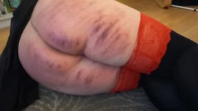 Fresh marks from a recent spanking session still visible