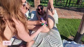 upskirt flashing surprise leads to lesbian sex toy play by the pool