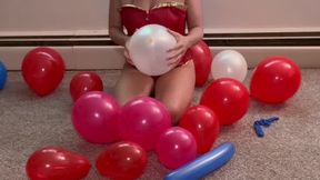 Super Woman popping Balloons