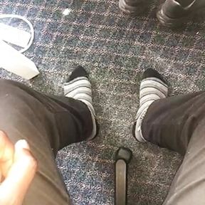 Young African feet out in socks in the office