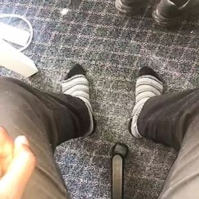 Young African feet out in socks in the office