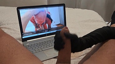 Milf jerks off a big cock until he cums on her gloves POV