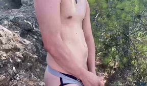 Naughty twink Sam Carter masturbates solo and cums outdoors