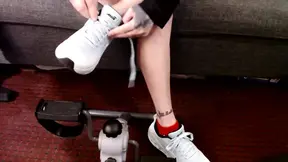 Braless babe bounces big tits and jiggles ankles on stationary bike