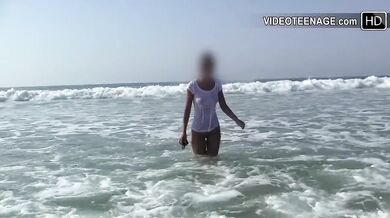 Brunette loses top at beach trying to stay dry shaved teen bubble butt