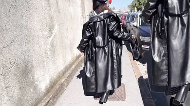Smoking Miss Sandra the leather clad dominatrix strolling in her boots