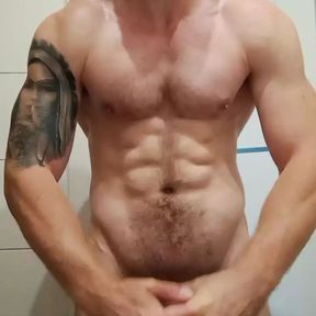 muscular guy is doing muscle worship and masturbate with cum