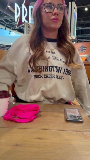 Woman in Washington State sweatshirt sitting at table